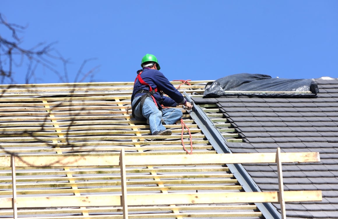 roofer is working on the roof